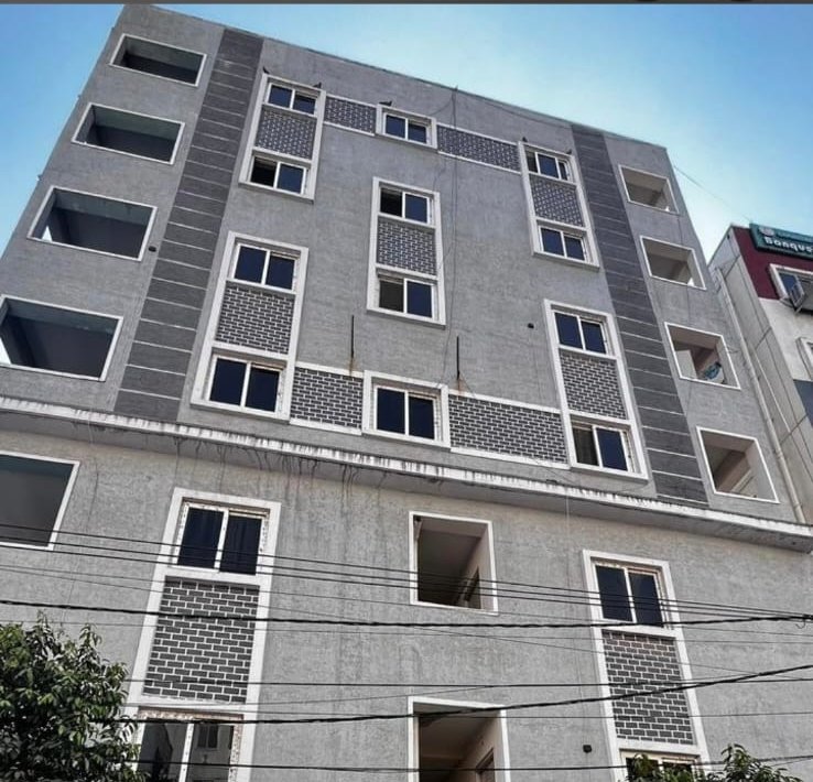 Orange Stays Hostel building exterior with Men's, Women's and Co-living PG signage, KPHB Phase 9